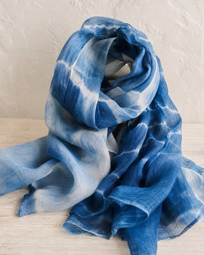 Washed blue silk cotton scarf draped in soft folds